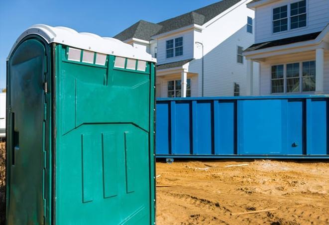 a row of portable toilets for construction workers on site